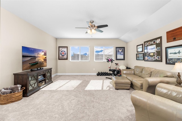 living room featuring ceiling fan, lofted ceiling, and light carpet