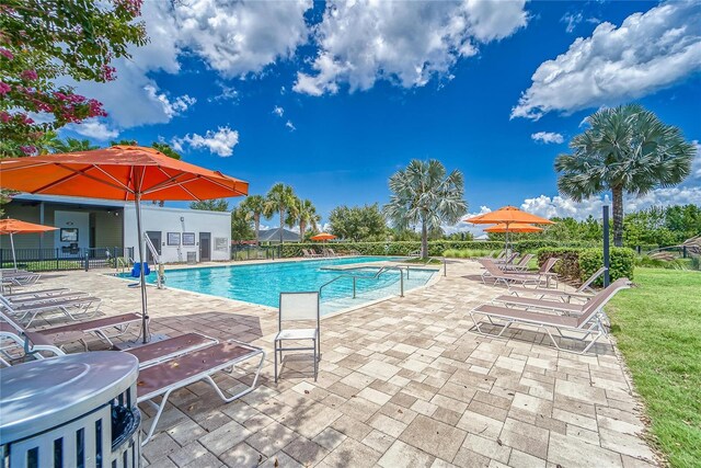 view of swimming pool featuring a patio area