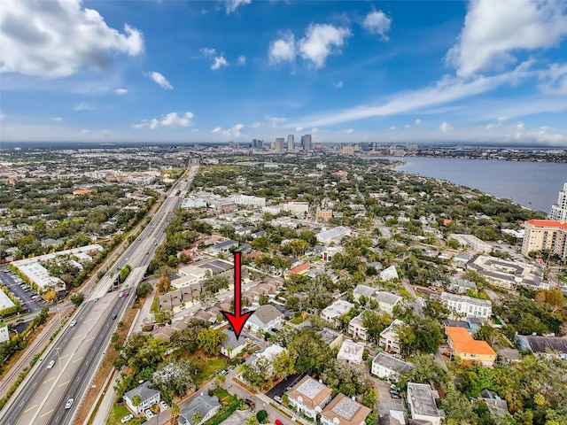 birds eye view of property with a water view