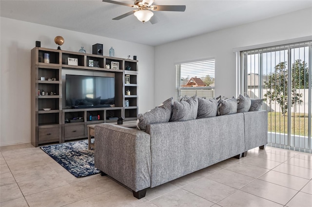 tiled living room featuring ceiling fan