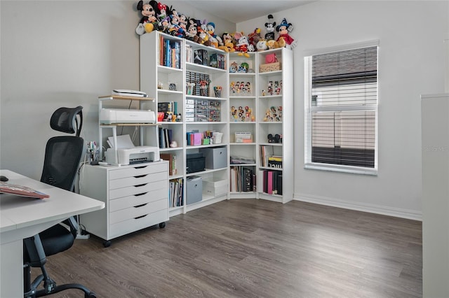 home office with dark hardwood / wood-style flooring