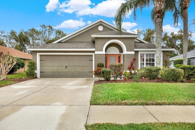 view of front facade featuring a garage and a front yard