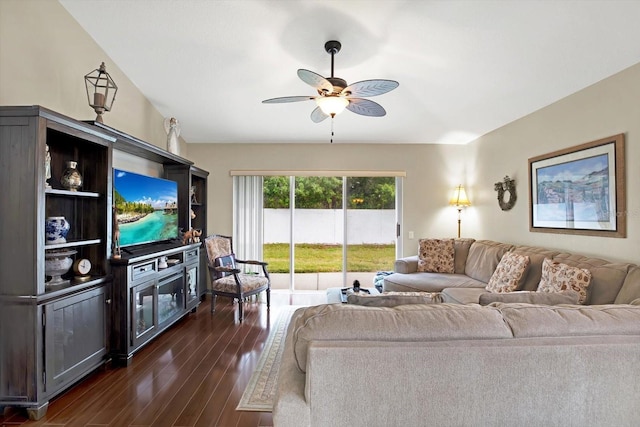 living room with ceiling fan and dark hardwood / wood-style floors