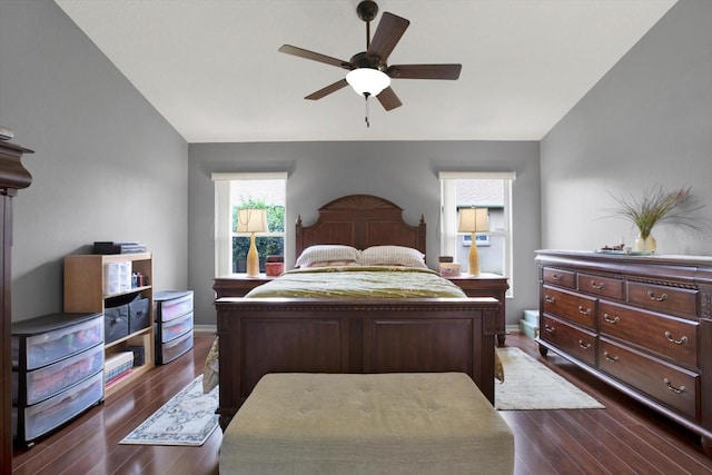 bedroom featuring lofted ceiling, ceiling fan, and dark wood-type flooring