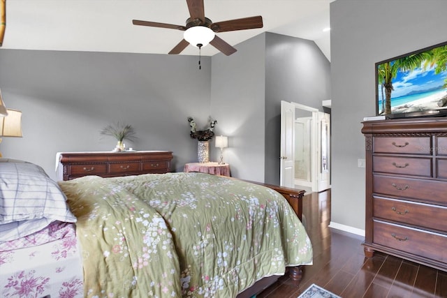 bedroom featuring lofted ceiling, ensuite bath, ceiling fan, and dark hardwood / wood-style floors