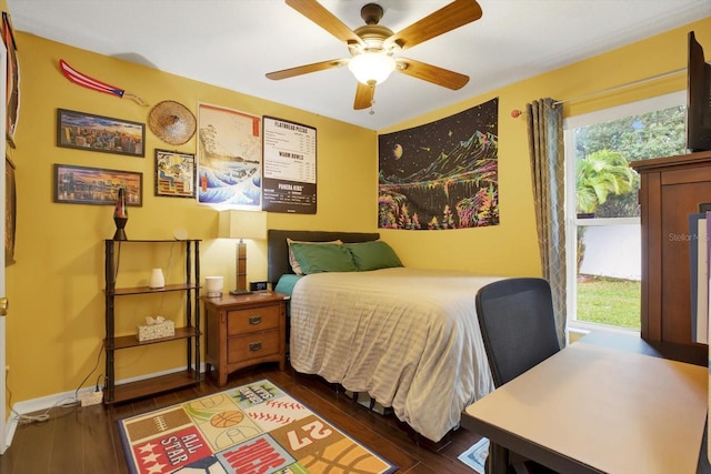 bedroom with ceiling fan and dark wood-type flooring