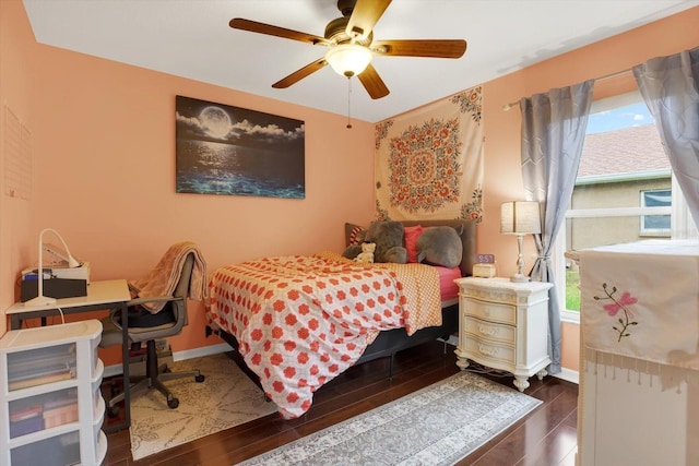 bedroom with ceiling fan and multiple windows