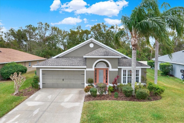 ranch-style home featuring a garage and a front yard