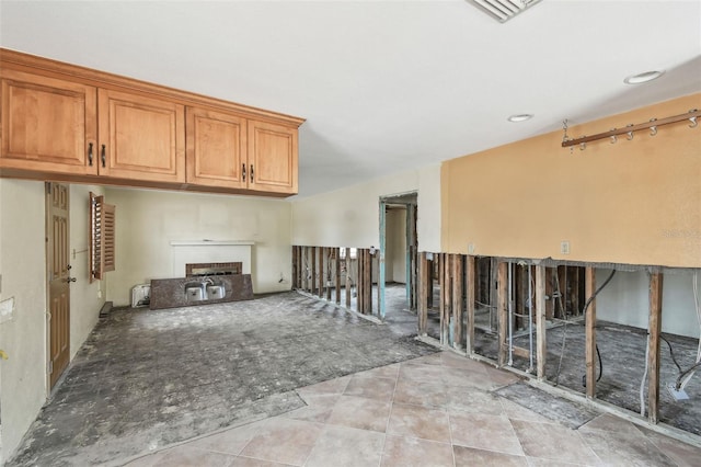 unfurnished living room with light tile patterned flooring