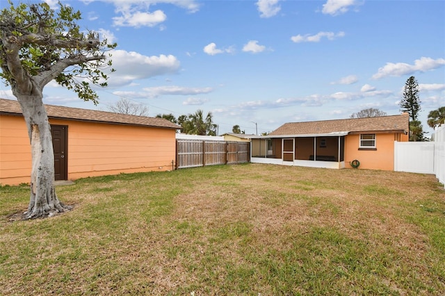 view of yard featuring a sunroom