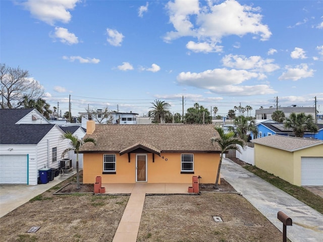 ranch-style house with cooling unit, a patio area, and a garage