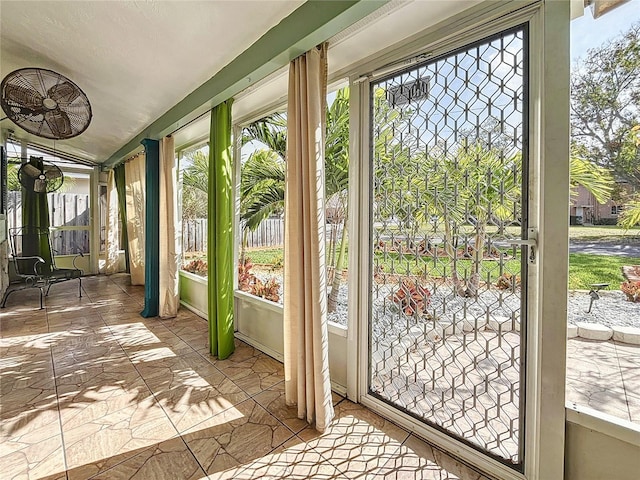 unfurnished sunroom with a healthy amount of sunlight