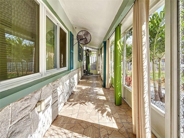 unfurnished sunroom featuring a wealth of natural light