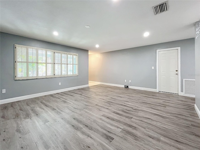 unfurnished room with light hardwood / wood-style flooring