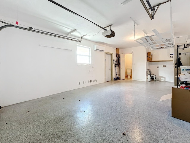 garage featuring a garage door opener and a wall mounted AC