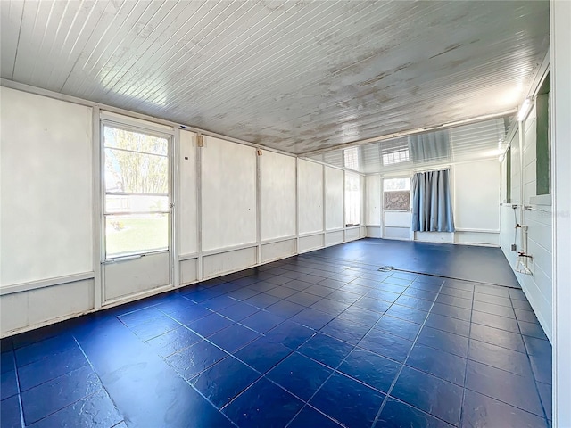 exercise room with wood ceiling