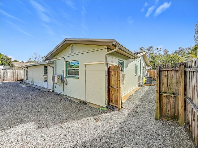 view of home's exterior with cooling unit