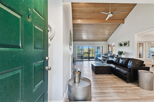 living room with ceiling fan, light wood-type flooring, wood ceiling, and high vaulted ceiling