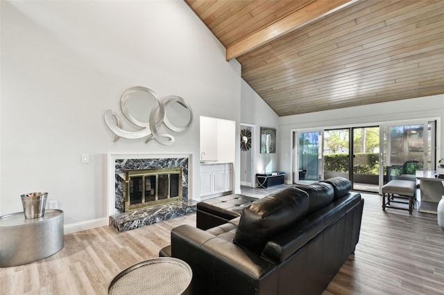 living room with wooden ceiling, a premium fireplace, beamed ceiling, high vaulted ceiling, and wood-type flooring