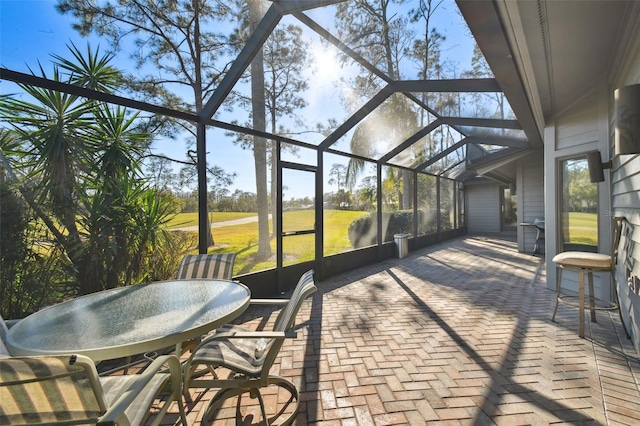 view of patio featuring a lanai