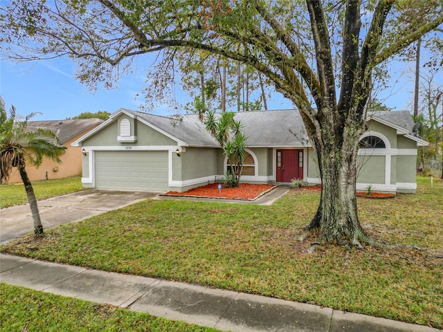 ranch-style house with a garage and a front lawn