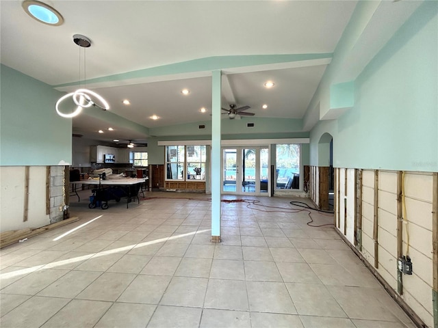 interior space with ceiling fan and vaulted ceiling