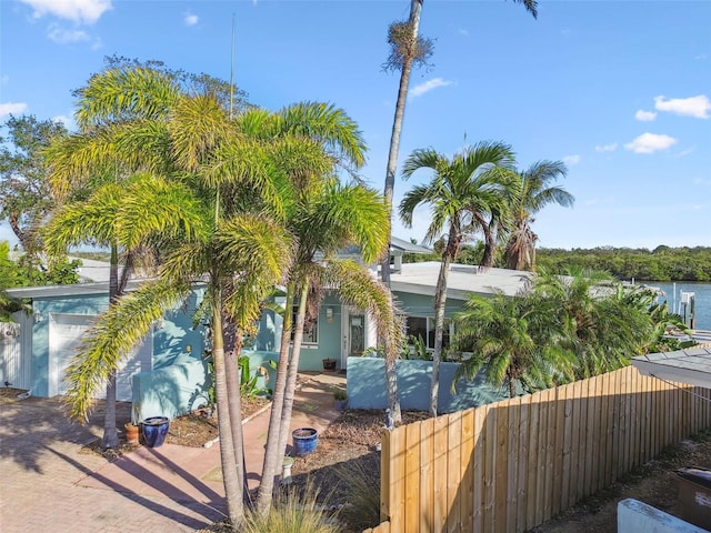 view of front of property with a water view