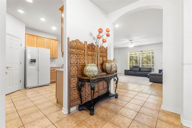 hall with light tile patterned floors