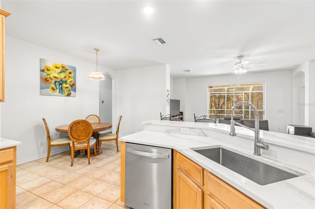 kitchen with ceiling fan, sink, light brown cabinets, dishwasher, and hanging light fixtures