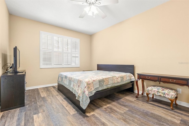 bedroom featuring ceiling fan and dark hardwood / wood-style flooring