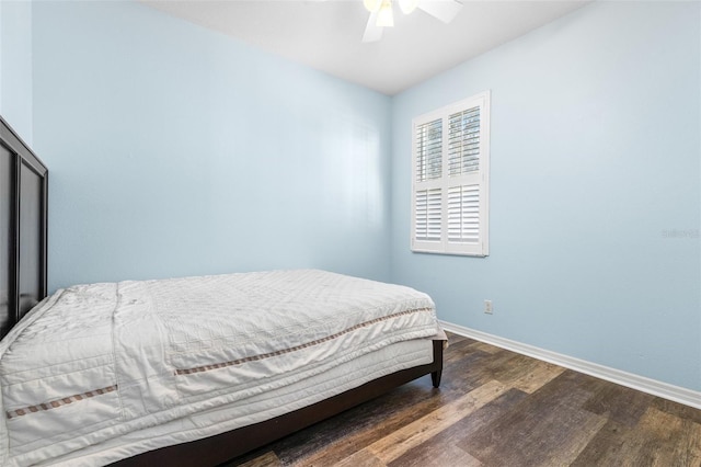 bedroom featuring ceiling fan and dark wood-type flooring