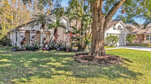 view of front facade with a front yard and a garage