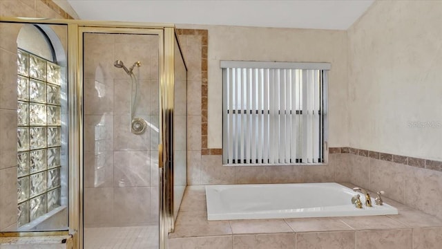 bathroom with separate shower and tub