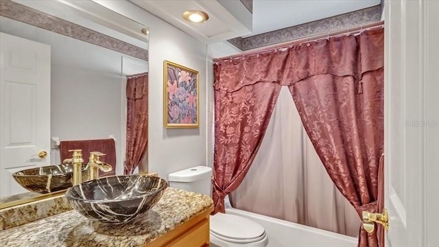 full bathroom featuring vanity, toilet, and shower / bath combo with shower curtain