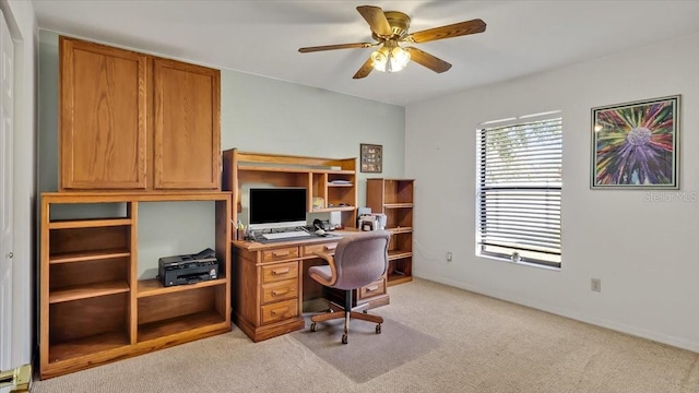 carpeted office space featuring ceiling fan and a baseboard radiator