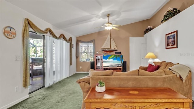 carpeted living room with ceiling fan, vaulted ceiling, and a healthy amount of sunlight