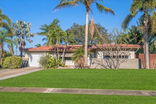 view of front of home with a garage and a front yard