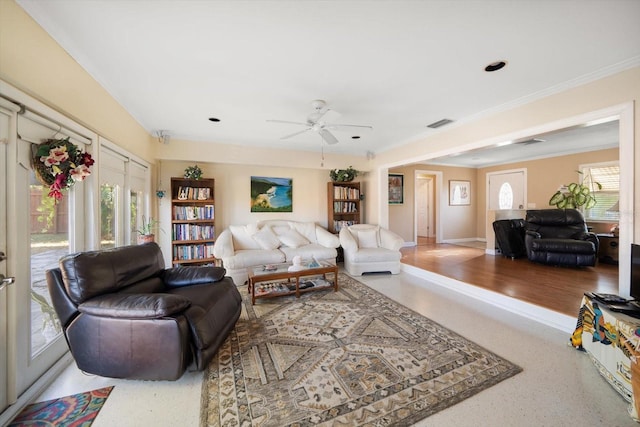 living room with ornamental molding and ceiling fan