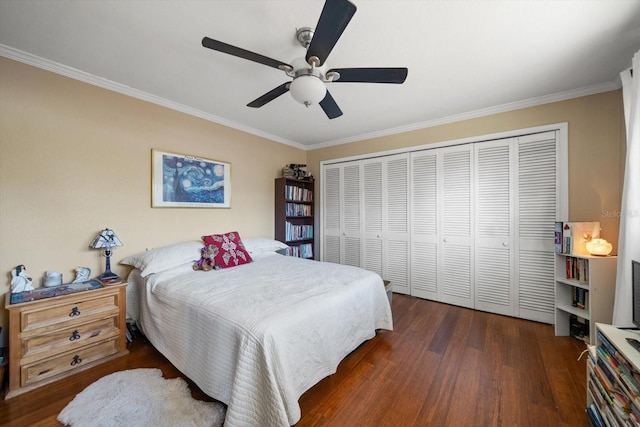 bedroom featuring ceiling fan, dark hardwood / wood-style flooring, ornamental molding, and a closet