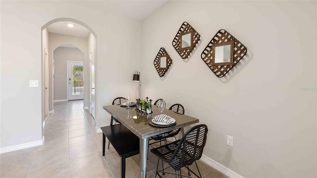 dining area with light tile patterned floors