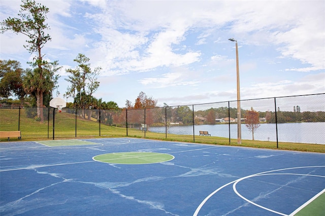 view of basketball court with community basketball court and fence