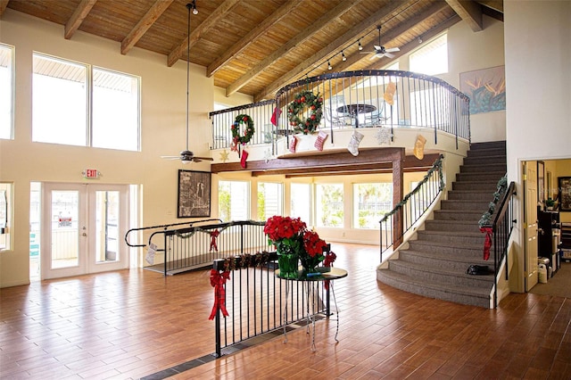 entrance foyer featuring stairway, wooden ceiling, and wood finished floors