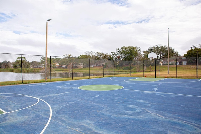 view of basketball court with community basketball court and fence