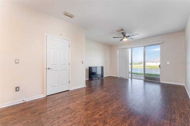 unfurnished living room with ceiling fan and dark hardwood / wood-style flooring