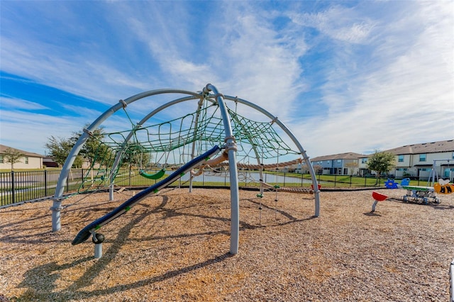 view of playground with a water view