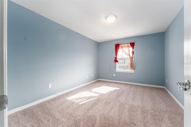 empty room featuring carpet floors