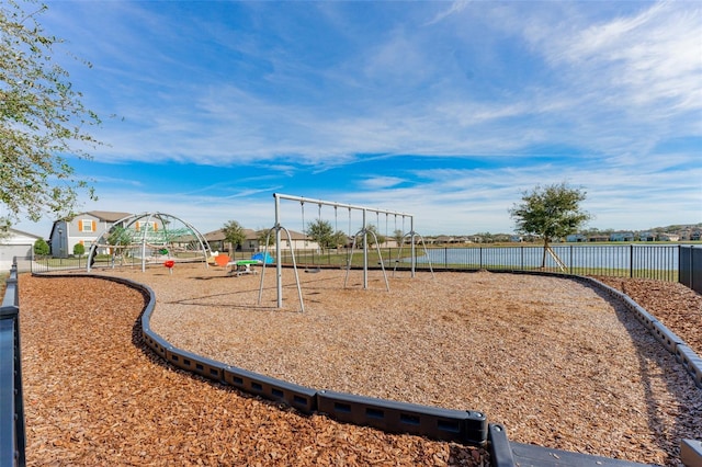 view of jungle gym with a water view