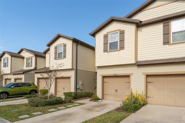 multi unit property featuring a garage