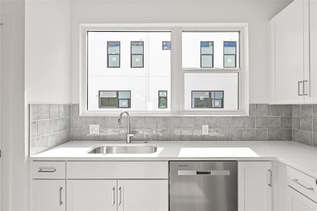 kitchen featuring sink, white cabinets, and stainless steel dishwasher