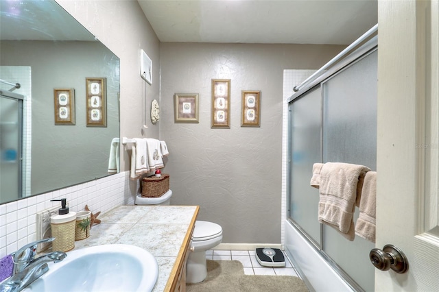 full bathroom with decorative backsplash, vanity, enclosed tub / shower combo, tile patterned flooring, and toilet